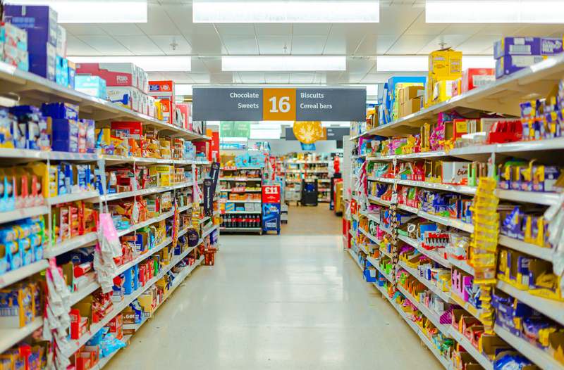 Overhead view of a well-organized Kings supermarket aisle with fresh produce, lean proteins, and whole-grain staples visible on shelves